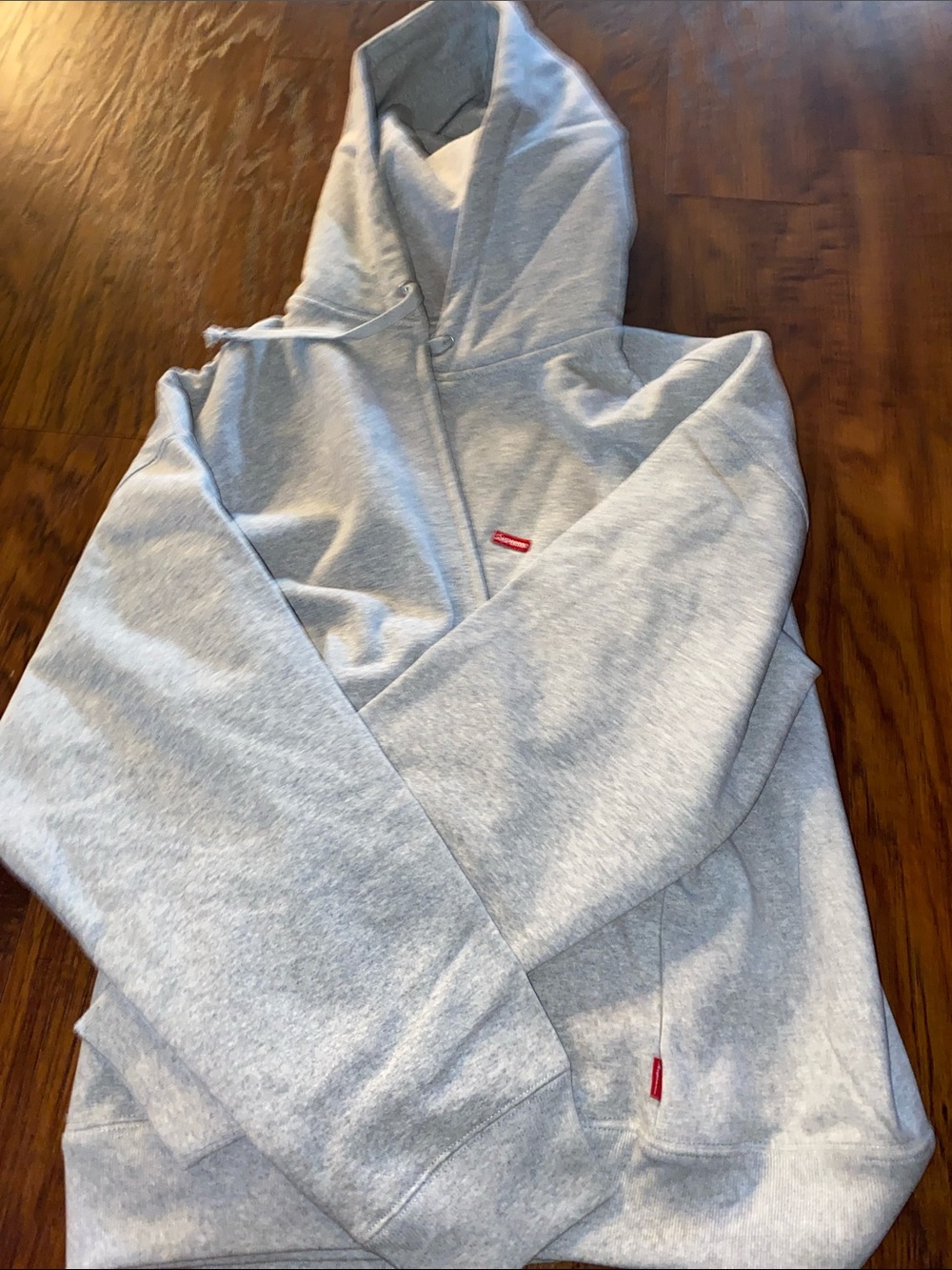 Supreme Light Gray Hoodie with Red Logo Tabs